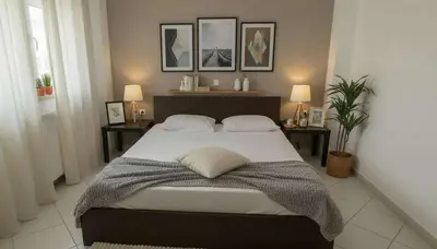a bedroom with a large bed with two end tables at The Calm Corner of Ampelokipoi in Athens