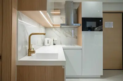 a kitchen with a sink and a faucet at Koukaki Urban Suites in Athens