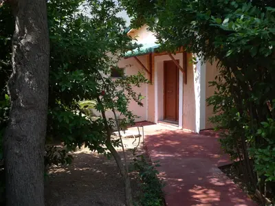 an entrance to a building with a door and trees at The Wooden Nest, Cozy Private Room in Spáta