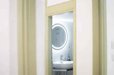 a bathroom with a sink and a mirror at Central Nest near Acropolis in Athens