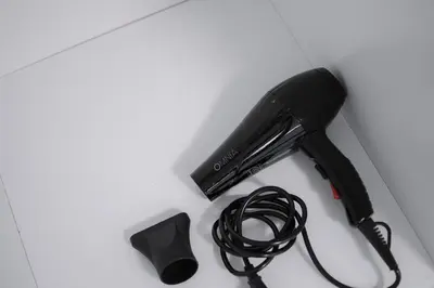 a black stapler and a cord on a table at Central Nest near Acropolis in Athens