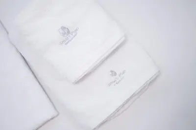 two white napkins sitting on top of a table at Central Nest near Acropolis in Athens