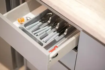 a drawer in a kitchen with knives in it at Panormou Neon - Urban Apartment 3A in Athens