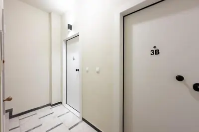 a corridor with a door and a mirror at Panormou Neon - Urban Apartment 3B in Athens