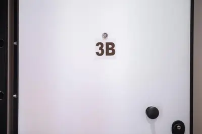 a refrigerator with the number on it at Panormou Neon - Urban Apartment 3B in Athens