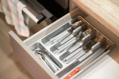 a drawer filled with utensils in a drawerlictsangering at Panormou Neon - Urban Apartment 3B in Athens