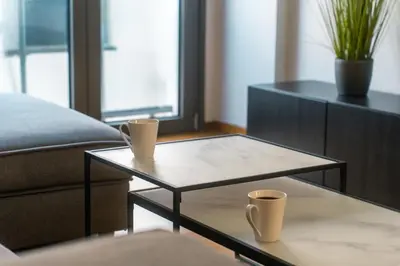 a living room with two coffee tables and a couch at Stylish Flat between Syntagma Sq and Kolonaki in Athens