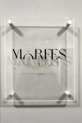 a sign with the name of the mrissettsetts at Morfes studio at historic center-near Acropolis in Athens