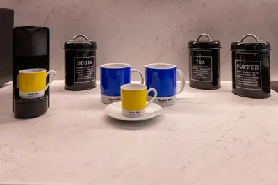 a group of coffee mugs sitting on a counter at Morfes studio at historic center-near Acropolis in Athens