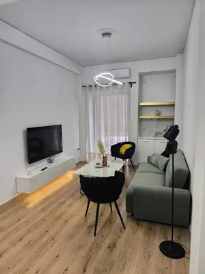 a living room with a couch and a table at S-eva resort athens apartments 2 in Athens