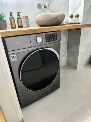 a black microwave sitting under a counter in a kitchen at S-eva resort athens apartments 2 in Athens