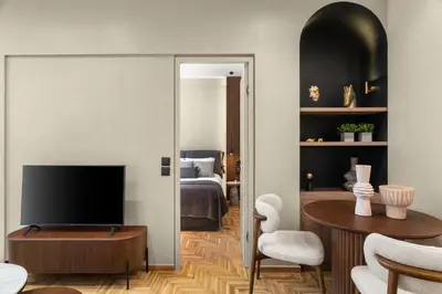 a living room with a television and a bedroom at ESTER Metropolitan Luxe - 2 Bedrooms 2 Bathrooms in Athens