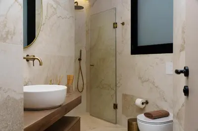 a bathroom with a sink and a shower at ESTER Metropolitan Luxe - 2 Bedrooms 2 Bathrooms in Athens