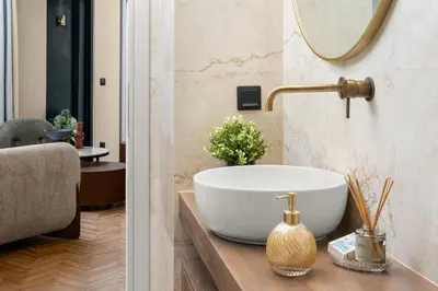 a bathroom with a bowl sink and a mirror at ESTER Metropolitan Luxe - 2 Bedrooms 2 Bathrooms in Athens