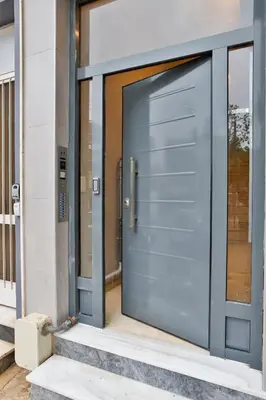 a blue door on a building at South Athens Apts New Collection by Live & Travel in Athens