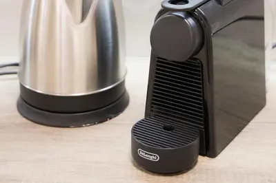 a coffee pot sitting next to a toaster oven at Panormou Neon - Urban Apartment 1A in Athens
