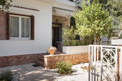 a house with a gate and a window at Elaia House Glyfada in Athens