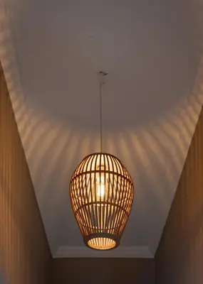 a lamp hanging from a ceiling in a room at Elaia House Glyfada in Athens