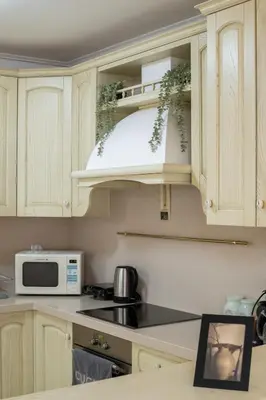 a kitchen with white cabinets and a microwave at Spacious 2BR, hot tub, prvt parking, near metro in Athens