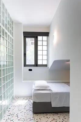 a bedroom with a bed and a window at Glass Nest Athens 2BR Apartment near Metro & Airport Line in Athens