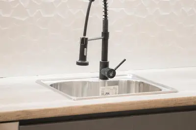a kitchen sink with a faucet on a counter at Panormou Neon - Urban Apartment 1B in Athens