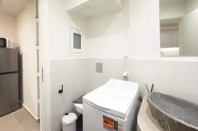 a small bathroom with a sink and a toilet at Panormou Neon - Urban Apartment 2B in Athens