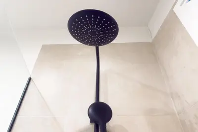 a black fan on the floor in a room at Panormou Neon - Urban Apartment 2A in Athens
