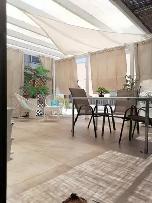 a dining room with a table and chairs in a tent at Roof Top appartement with huge Terrace in Athens