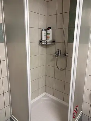 a bathroom with a shower stall with a shower at Bright Koukaki Studio -10 min Walk to Acropolis in Athens