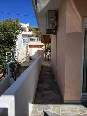a stairway leading up to a building at Daskalio Waves Appartment Filias in Dhaskalión