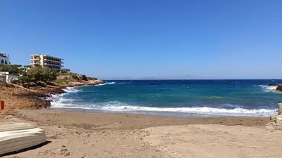 a view of the ocean from a sandy beach at Daskalio Waves Appartment Filias in Dhaskalión
