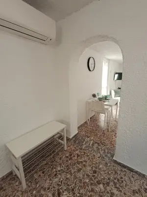a living room with a bench and a table at Daskalio Waves Appartment Agapi in Dhaskalión