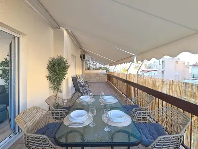 a balcony with a table and chairs on a patio at Kalliannassa in Piraeus