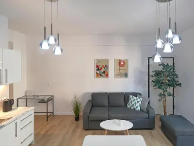 a living room with a couch and a table at Kalliannassa in Piraeus