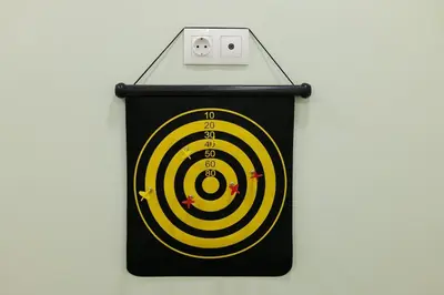 a clock with a yellow and black target at 2 BR Apartment with Sitcom Vibes VIPGreece in Athens