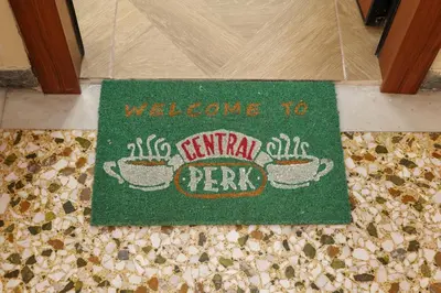 a welcome to kirribilli park rug on a floor at 2 BR Apartment with Sitcom Vibes VIPGreece in Athens