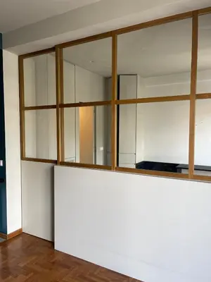a room with white walls and glass windows at Cosy, Athens core fully renovated apartment in Athens