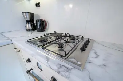 a stove top oven sitting on top of a counter at City Panorama Studio by ΜΡS in Athens