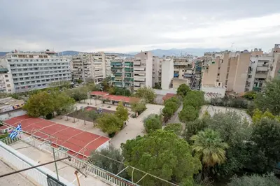 a view of a city with buildings and a tennis court at City Panorama Studio by ΜΡS in Athens
