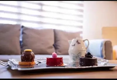 a tray with three different types of desserts on a table at Detached Garden House in Athens