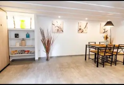 a dining room with a table and some chairs at Detached Garden House in Athens