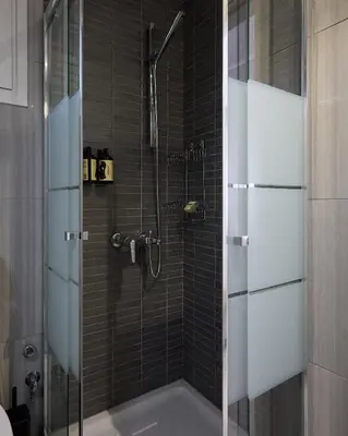 a bathroom with a shower with a bath tub at Sofokleous central studio in Athens