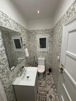 a bathroom with a sink and a toilet at CasaCentrale in Athens