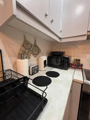 a kitchen with a counter with a microwave and a stove at CasaCentrale in Athens