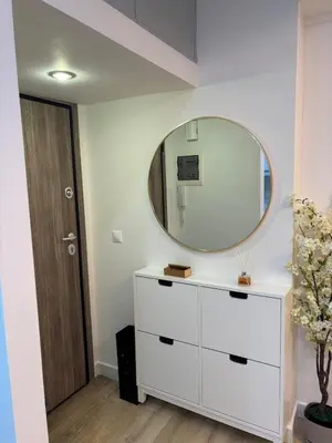 a bathroom with a white dresser and a mirror at CasaCentrale in Athens