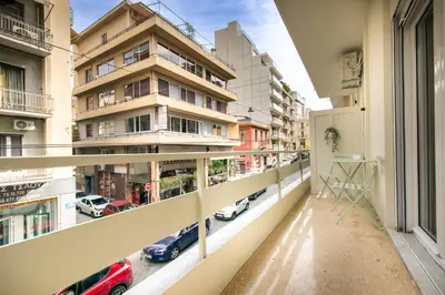 an apartment balcony with a view of a street at Kallimarmaro Gem II in Athens