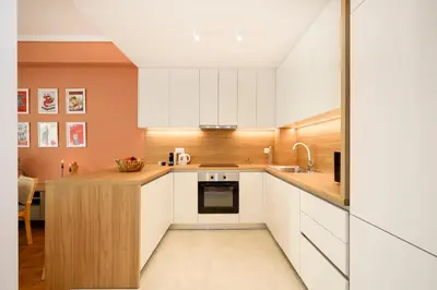 a kitchen with white cabinets and a sink at Kallimarmaro Gem III in Athens