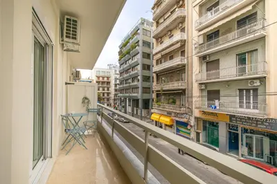 an apartment balcony with a view of a street at Kallimarmaro Gem I in Athens