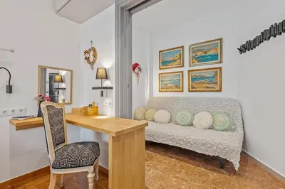 a room with a desk and a bed in a room at h2h Kalypso #Luxury smART, hi-tec, with parking, in 1'metro in Piraeus