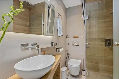 a bathroom with a sink and a toilet and a shower at h2h Erato #Luxury, tech, smART with parking, in 1' metro in Piraeus